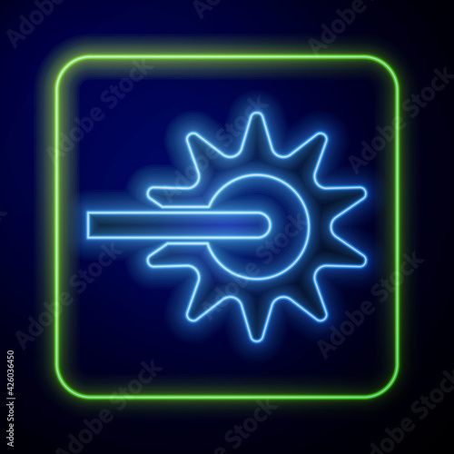 Glowing neon Cowboy horse riding spur for boot icon isolated on blue background. Vector