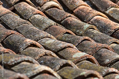 Roof tiles an old Bulgarian house. View from the front, an abandoned village in Crimea.