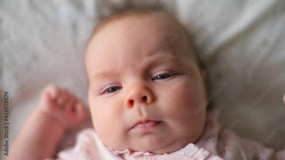 Close-up portrait of a child, the face of a two-month-old baby. Eyebrow movement when expressing emotion. Close-up portrait of a child, the face of a two-month-old baby. Eyebrow movement when expressing emotion.