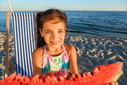 Little girl eating watermel...