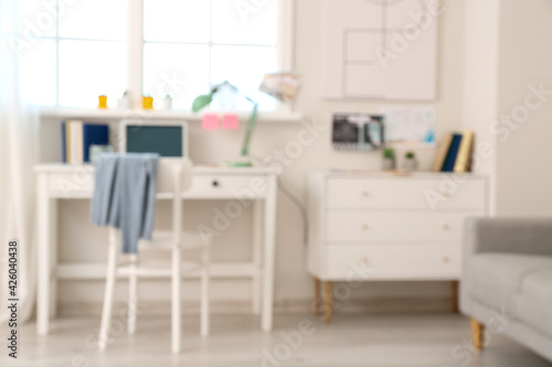 Stylish workplace with laptop in office, blurred view © Pixel-Shot
