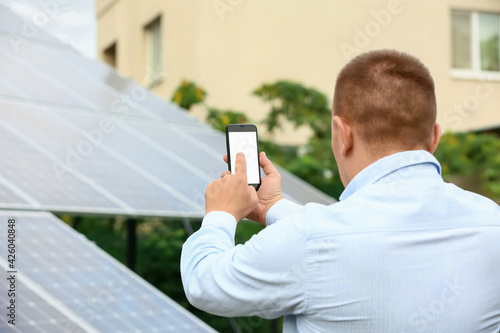 Man with mobile phone near ...
