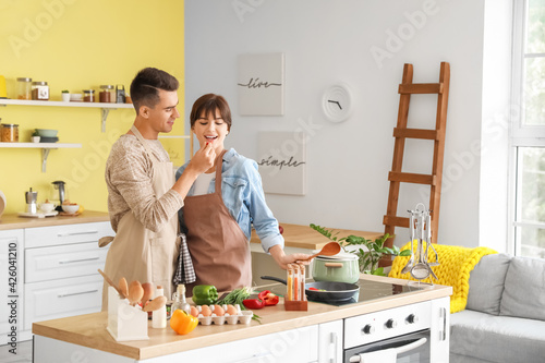 Happy young couple cooking ...