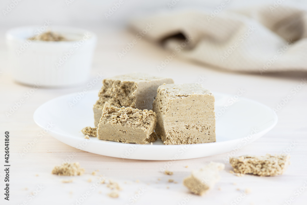 Halva pieces on a white plate.