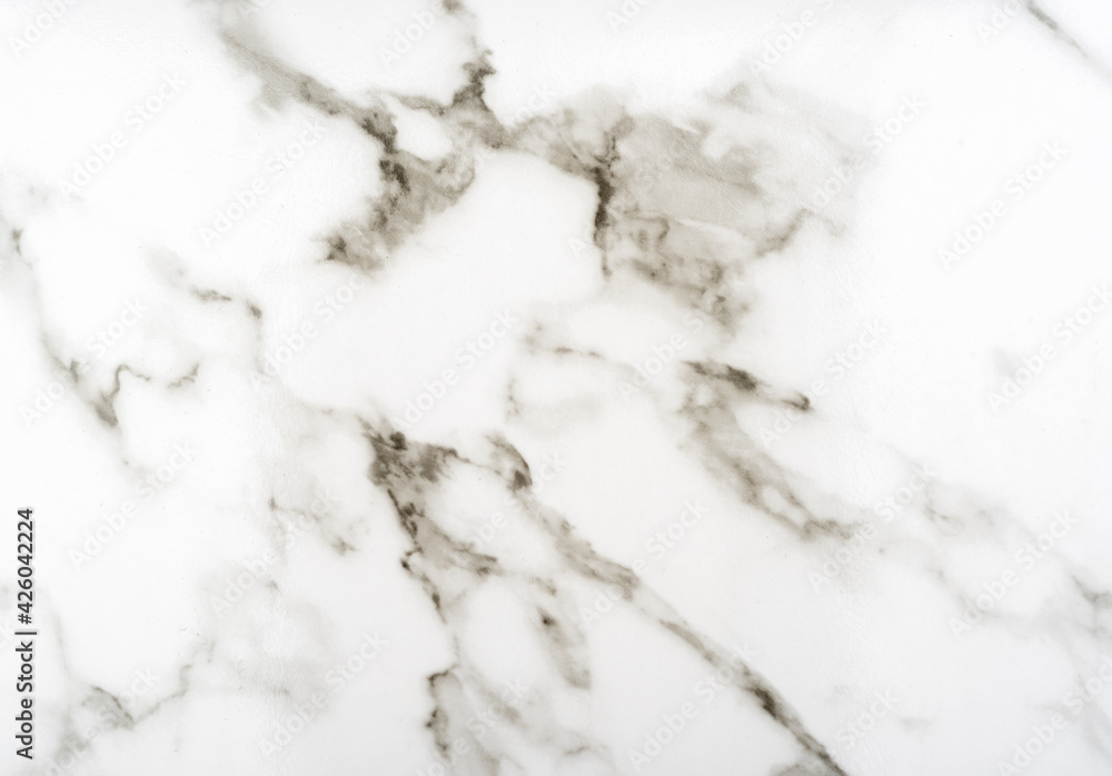 Full frame abstract pattern of marble on a plastic surface.