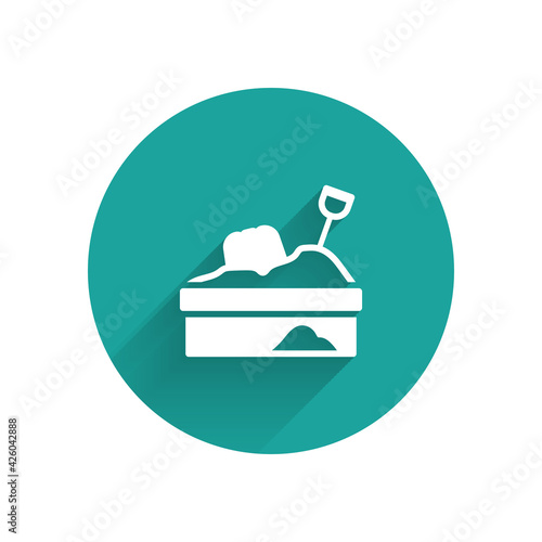 White Sandbox with sand icon isolated with long shadow. Green circle button. Vector