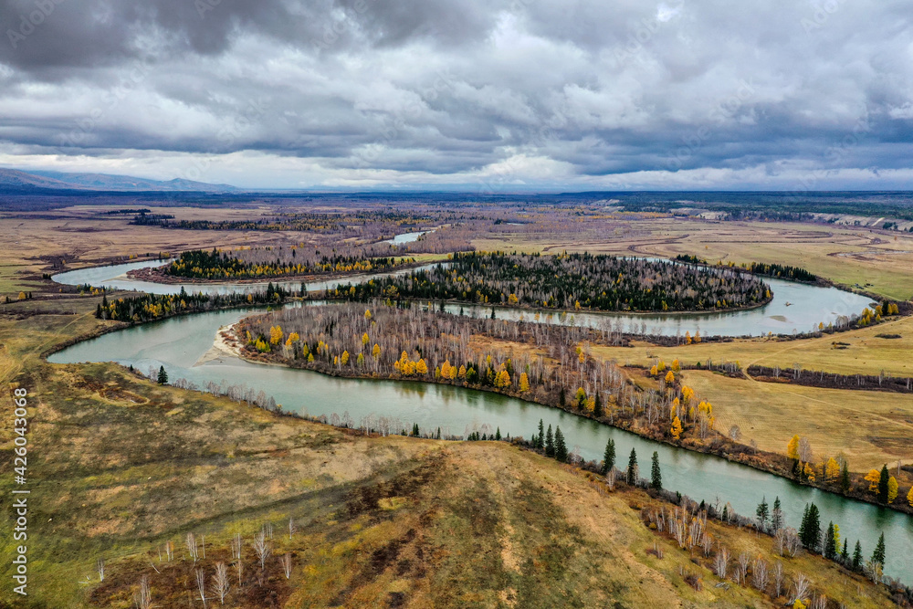 Eastern Sayans in autumn. Tunka valley before the rain. Irkut River.