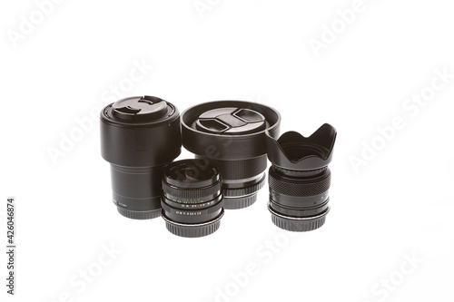four lenses stand on a white background