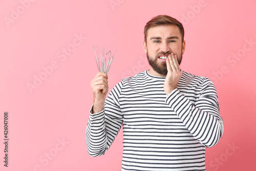 Scared young man with denta...