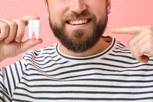 Young man with plastic toot...