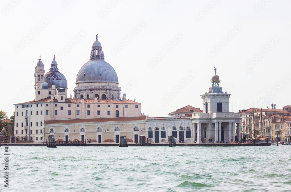 The Basilica Di Santa Maria Della Salute, view from the the Grand Canal in Venice, Italy. Italian buildings cityscape. 