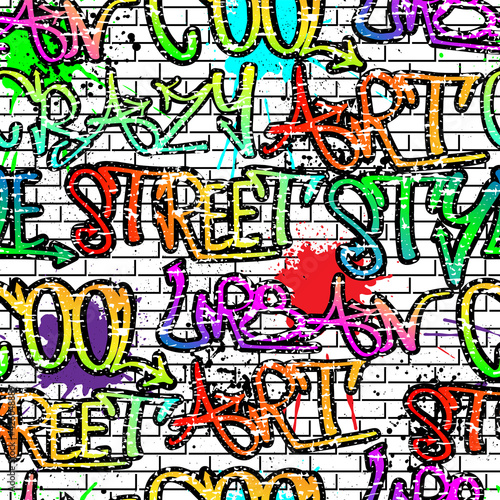 Seamless graffiti pattern on white bricks and blots, urban style for guys.