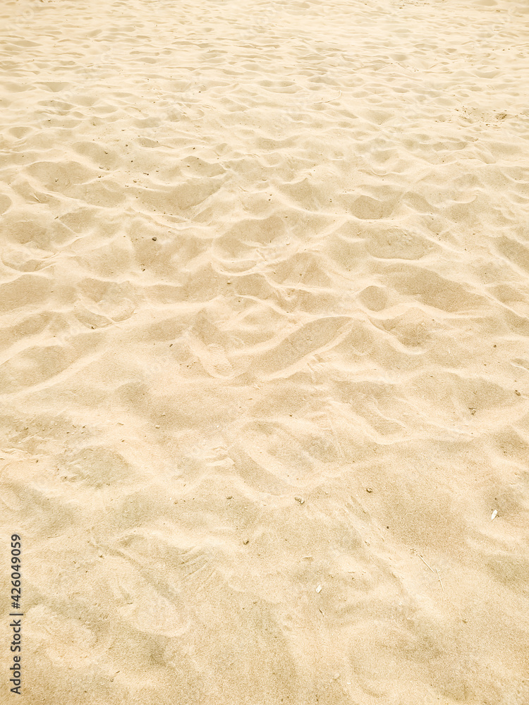 Beautiful of the beach sand texture in summer sun. Background Stock Photo