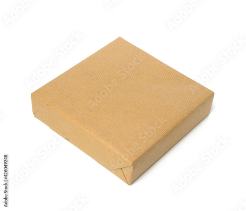 square box wrapped in brown kraft paper, packaging
