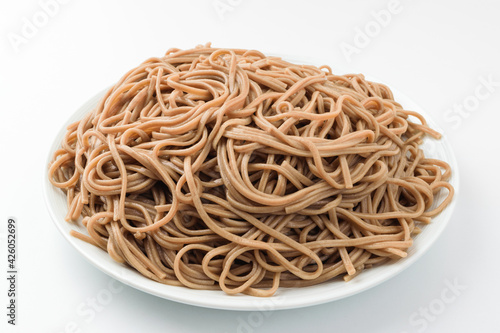 Buckwheat noodles on a white background