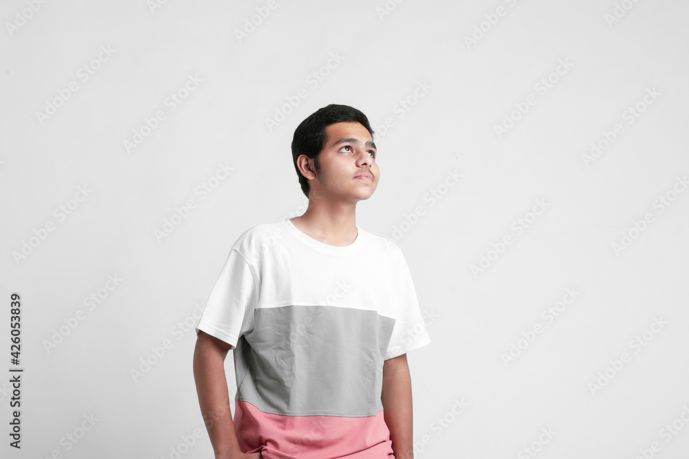 young indian boy showing expression on white background young indian boy showing expression on white background