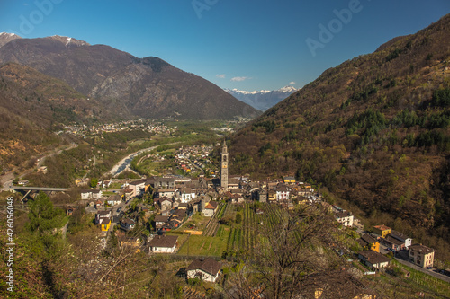 Landscape view of the mountain town of Intragna, with mountains in the background, shot in Centovalli, Ticino, Switzerland photo