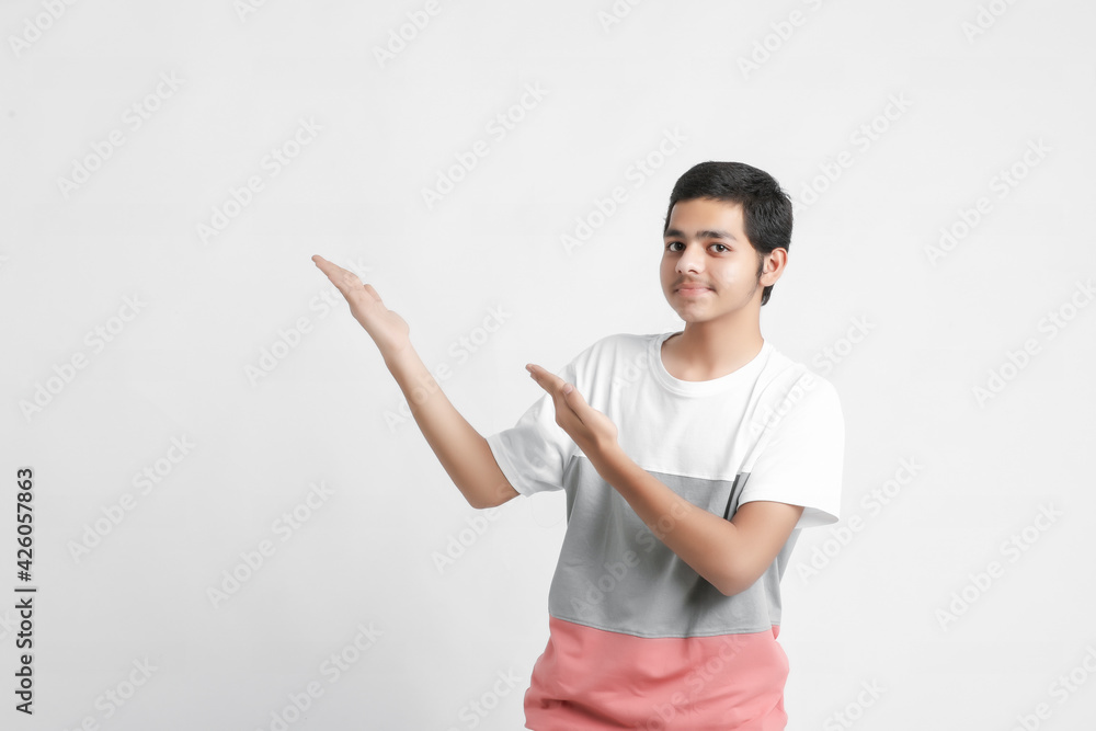 young indian boy showing expression on white background young indian boy showing expression on white background