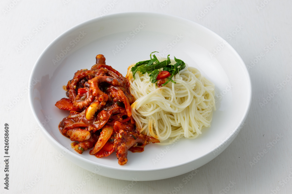 Spicy Squid Stir Fry which is called Ojingeo Bokkeum with thin white noodle Spicy Squid Stir Fry which is called Ojingeo Bokkeum with thin white noodle
