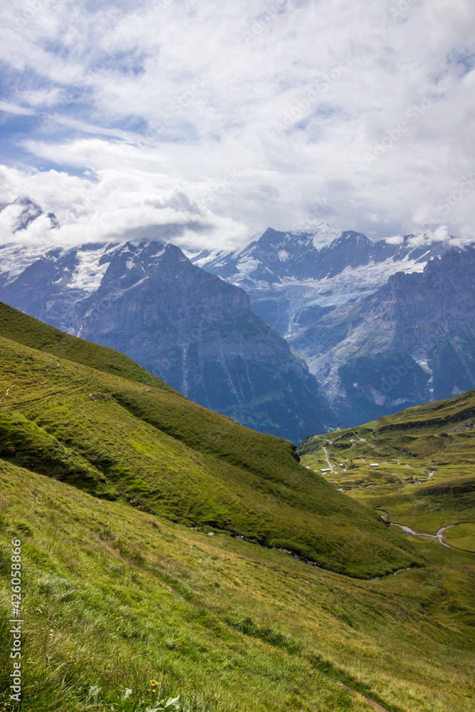 The Grindewald Valley and mountain pastures in Switzerland The Grindewald Valley and mountain pastures in Switzerland