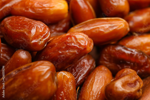 Sweet dried dates as background, closeup