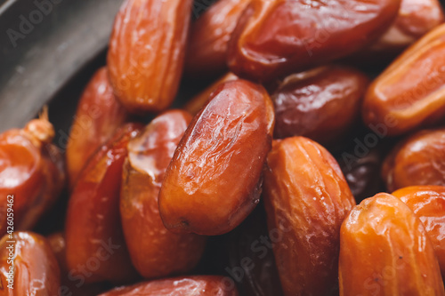 Plate with sweet dried dates, closeup
