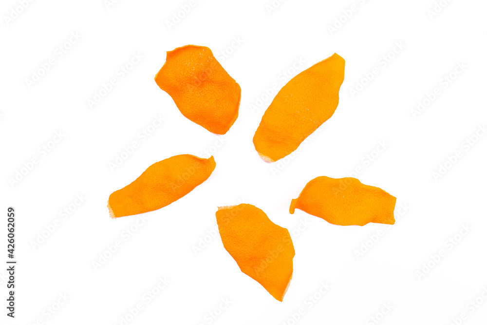 Dried orange peels isolated on a white background, close-up Dried orange peels isolated on a white background, close-up