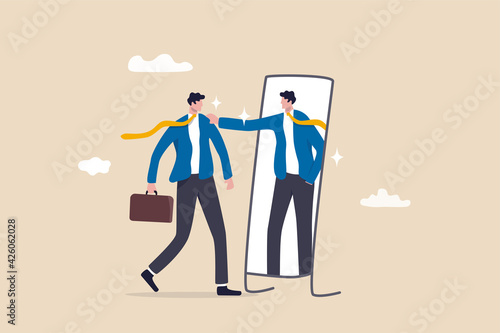 Self esteem or self care, believe in yourself improving confident, respect in your strong attitude concept, frustrated businessman looking at mirror with his shadow encourage his confidence. photo