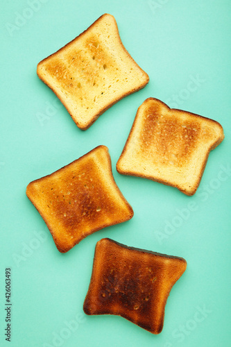 Slices of toast bread on mint background