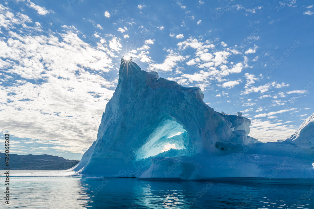 Sunburst on iceberg in Holms O, Baffin Bay, on the northwest coast of Greenland, Polar Regions Sunburst on iceberg in Holms O, Baffin Bay, on the northwest coast of Greenland, Polar Regions