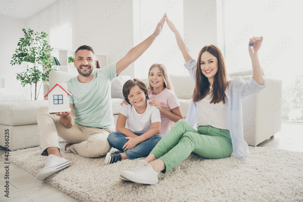 Photo portrait of family spending time together bought new house smiling happy dad keeping paper house safety trust Photo portrait of family spending time together bought new house smiling happy dad keeping paper house safety trust