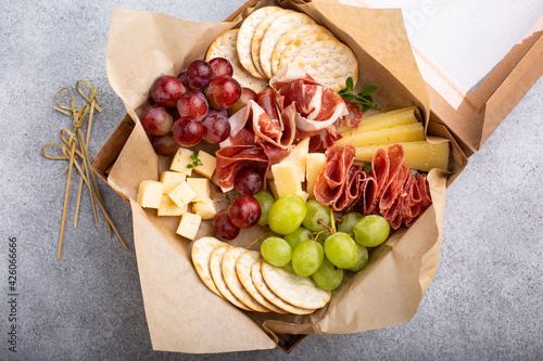 Canvas Print Charcuterie board in a box with cheese and meat