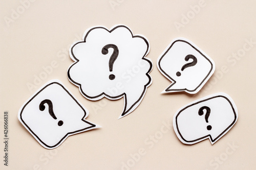 Question mark on paper bubbles, top view. Question concept