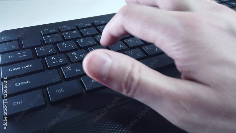 Male hands on PC keyboard close up, man quickly types text. Concept of office or home work at computer. Male hands on PC keyboard close up, man quickly types text. Concept of office or home work at computer.