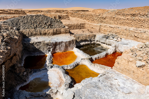 Multi coloured salt pools in the Salt mines of Bilma, Tenere desert, Niger, West Africa photo