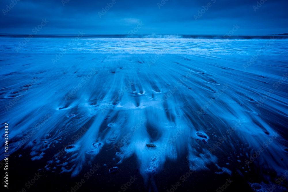 © robertharding - Receding tide at dawn, Oxwich Bay, Gower Peninsula, Swansea, Wales, United Kingdom