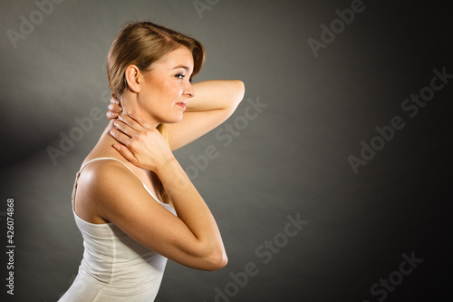 Woman suffering from neck pain © anetlanda
