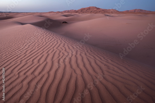 Blue hour on the Sahara Desert sand dune patterns, Erg Chebbi, Merzouga, Morocco, North Africa photo