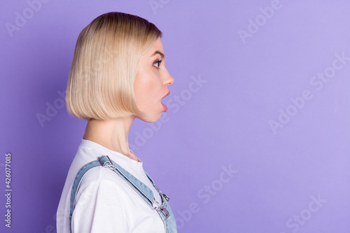 Profile photo of nice impressed short hairdo blond lady wear white t-shirt isolated on violet color background