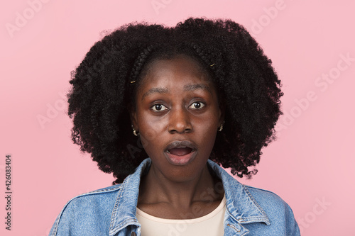 African-american woman portrait isolated on pink studio background with copyspace