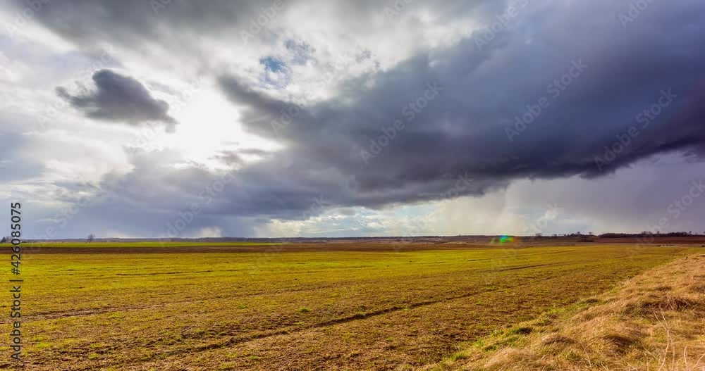Timelapse. White clouds move quickly across the blue sky over fields Timelapse. White clouds move quickly across the blue sky over fields