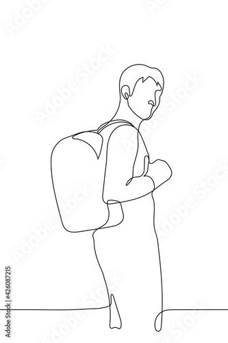 guy stands with his back to the viewer and looks at him, on his back there is a backpack - one line drawing. Concept of student or tourist with bag on the back