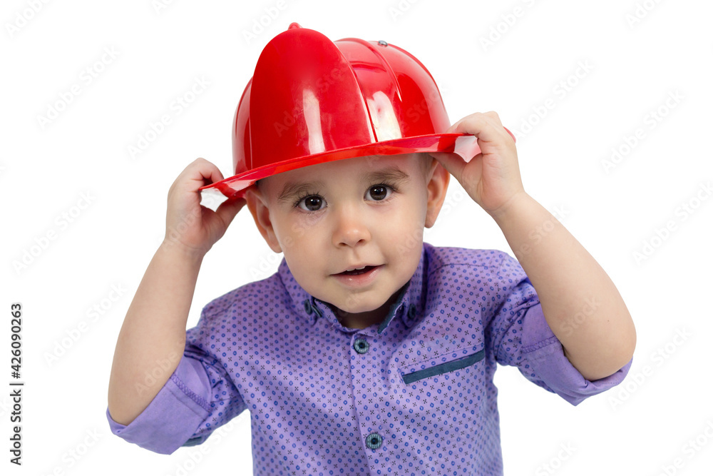Boy with hands holds a hard hat on his head, isolate white background. Boy with hands holds a hard hat on his head, isolate white background.