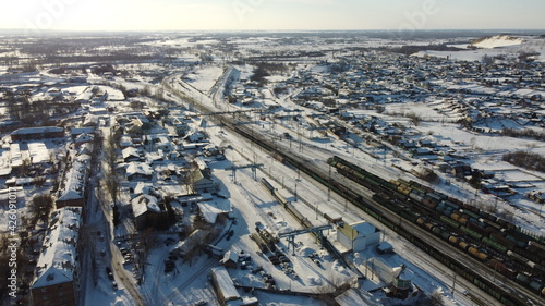 Small city in Siberia Russia with a railway road in the middle
