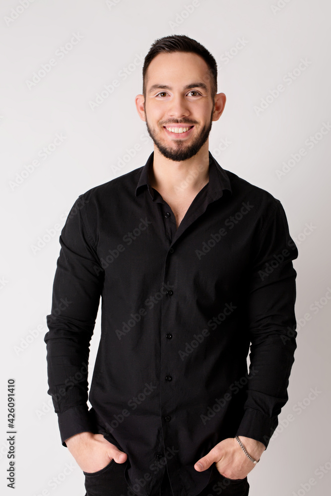 Young confident smiling friendly man in black shirt Young confident smiling friendly man in black shirt