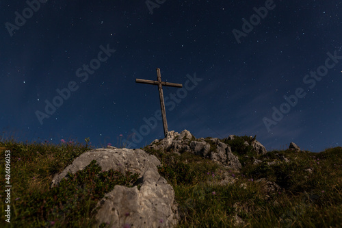 Summit cross at night, Benediktenwand mountain, Bavaria, Germany