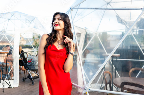 Woman wearing red dress outdoor