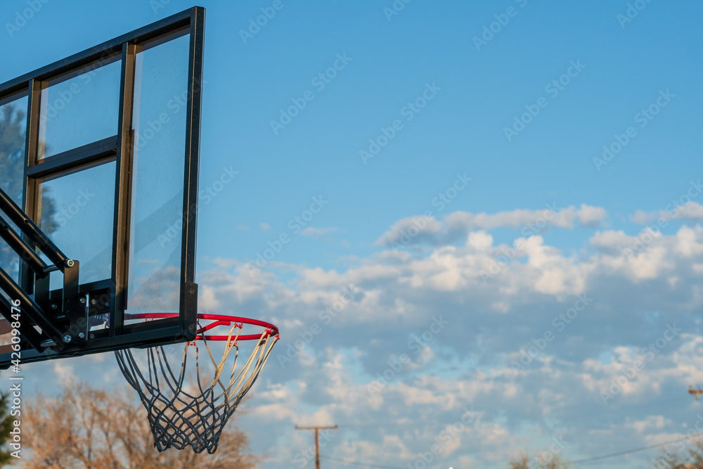 basketball hoop against blue sky