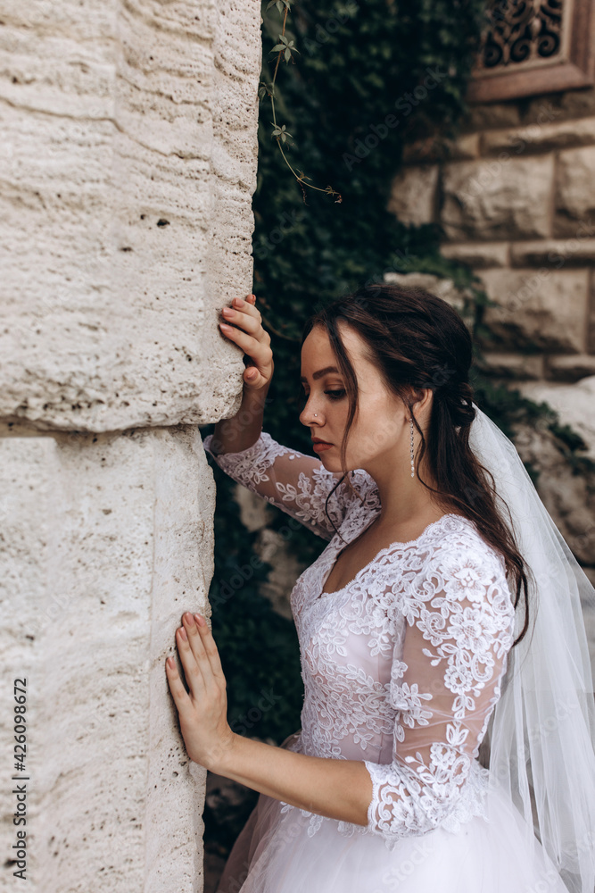 Portrait of the bride in a white dress. Photoshoot in the garden. Portrait of the bride in a white dress. Photoshoot in the garden.