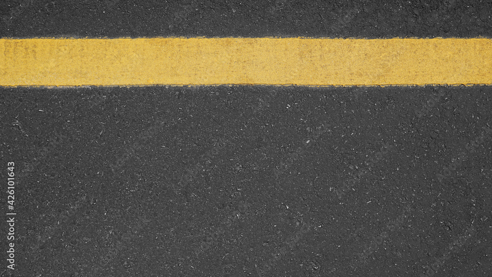 Surface rough of asphalt, Grey with yellow line on the road and small rock, Texture Background, Top view